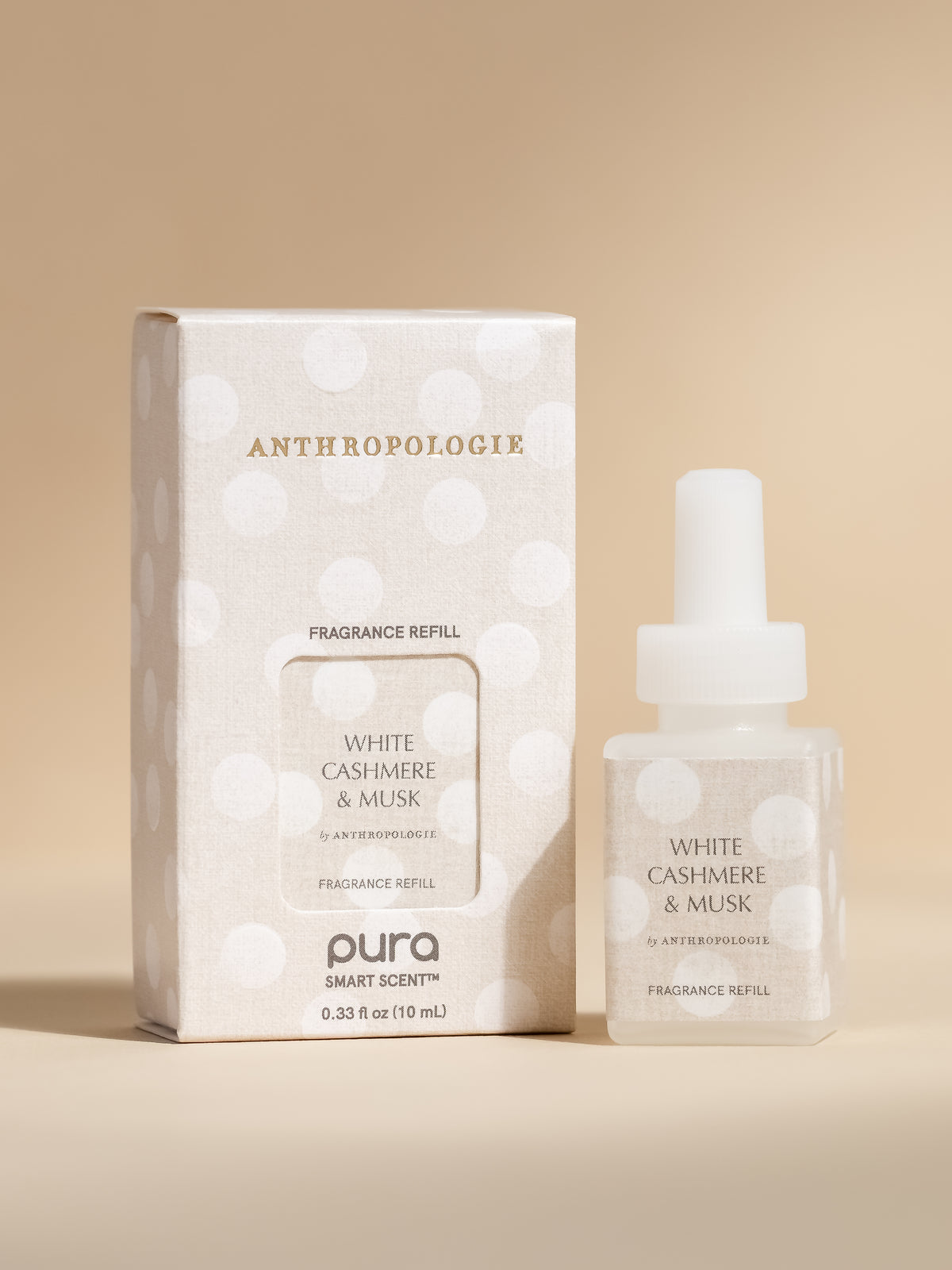 Antrhopologie White Cashmere & Musk fragrance vial and packaging on a beige background