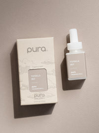 Pura Vanilla Sky fragrance vial and product packaging on a neutral background
